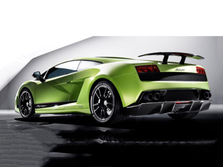 Green Lamborghini coupe with a large rear wing, rear three-quarter view